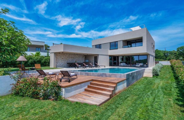 Luxury beachside villa with a pool and a sea view