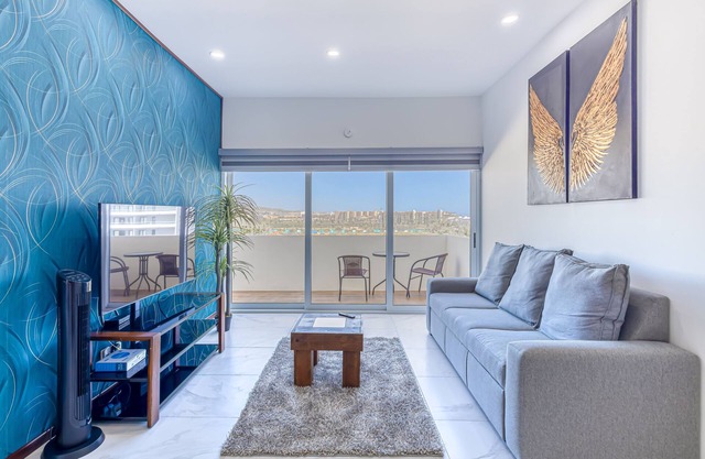 Luxury condo with shared gym, rooftop pool, and centrally located