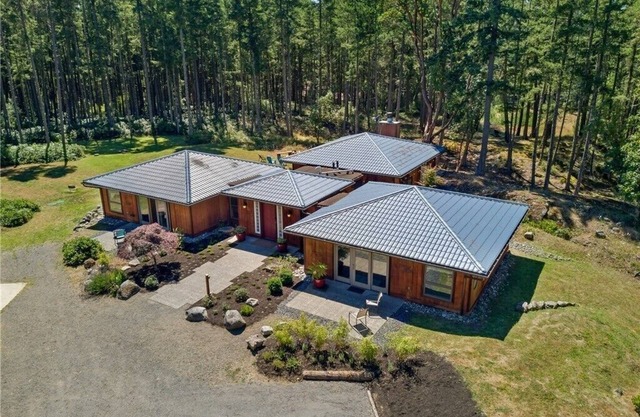 Luxury four bedroom home on sixteen acres of wooded privacy.