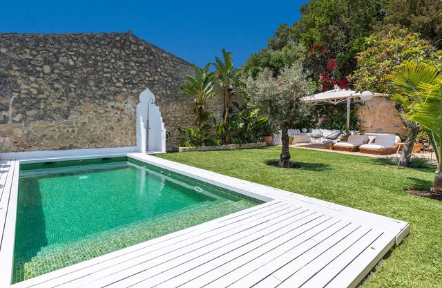 Luxury townhouse with garden and heated pool.