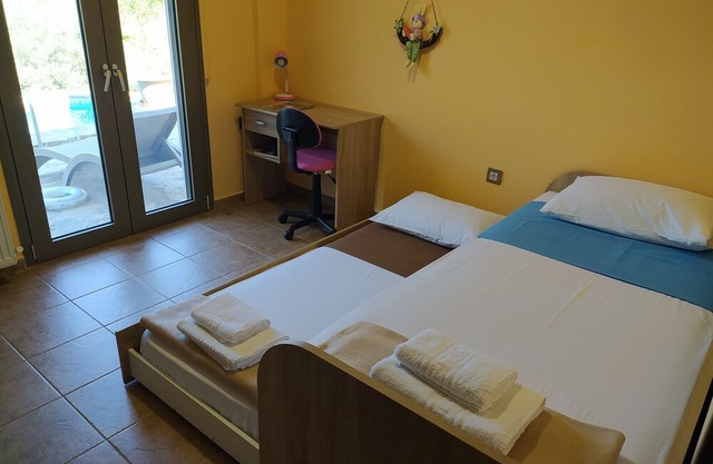 LUXURY VILLA KASTANIA WITH PRIVATE POOL SURROUNDED BY TREES, FLOWERS AND HERBS.