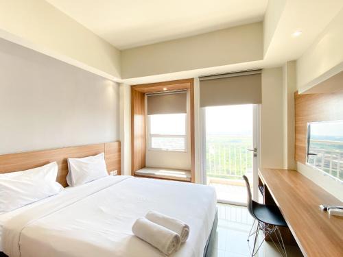 Minimalist and Homey Studio Apartment at Mustika Golf Residence By Travelio