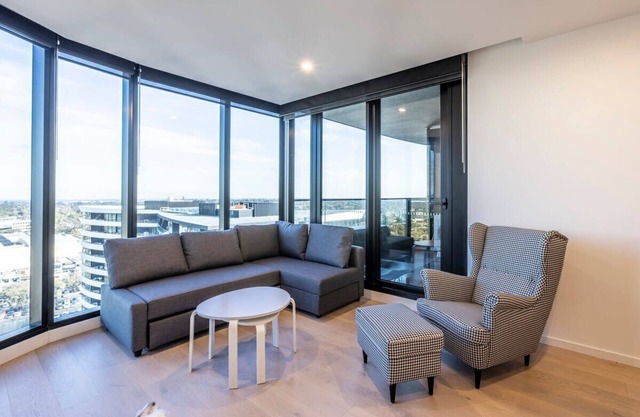 Modern 2BR Abode with Balcony View & Gym Access