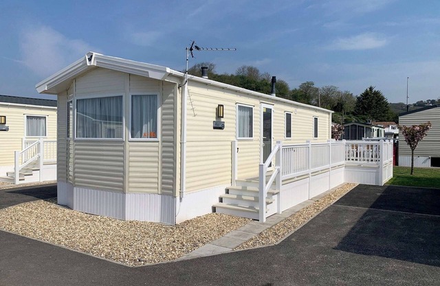 Modern and contemporary 12ft-wide caravan with one double and two twin.