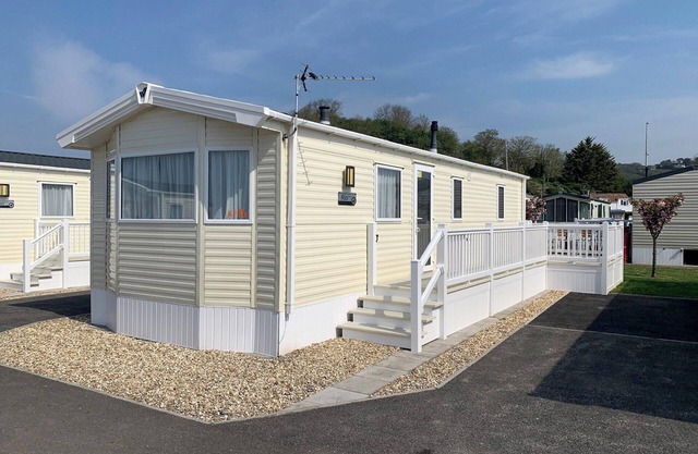 Modern and contemporary 12ft-wide caravan with one double and one twin.