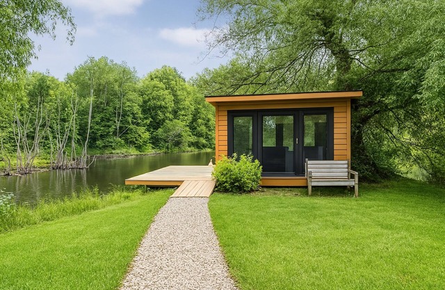 New Remodel on Black River with Hot Tub, Kayaks, Gym, Fireplace, & Game Room!