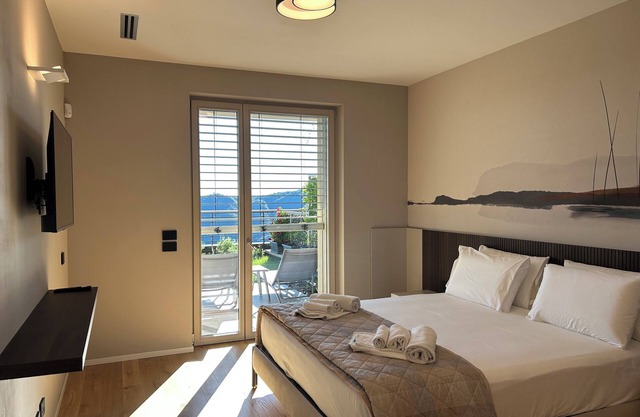 New stylish apartment with panoramic terrace and patio overlooking Lake Como.
