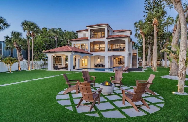 NEW Waterfront 6 bedroom home with large pool and luxurious outdoor living area!