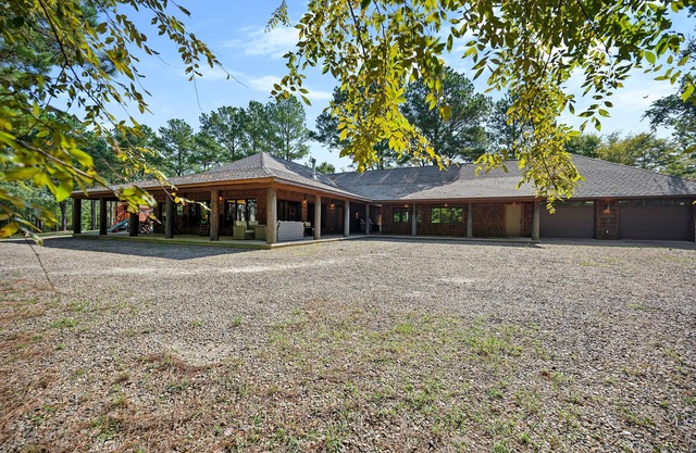 One story Luxury home on large, wooded acreage