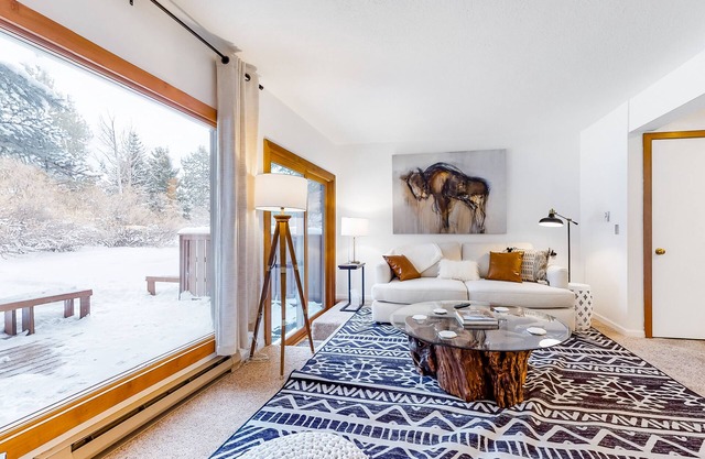 Open and inviting, two-story condo with full kitchen, patio, and wildlife views