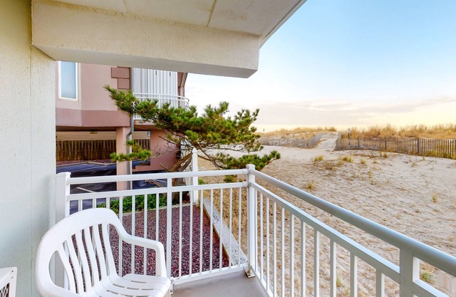 Partial Ocean View Condo in Oceanfront Building with Balcony, WiFi & Laundry