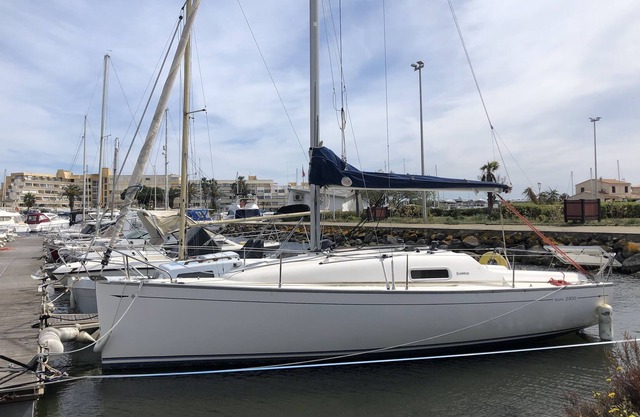 Pretty sailboat at the quay on the quiet side of the naturist port