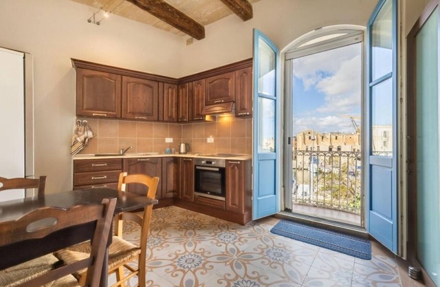Promenade home of character by Valletta ferry terminal. Local captivating tours