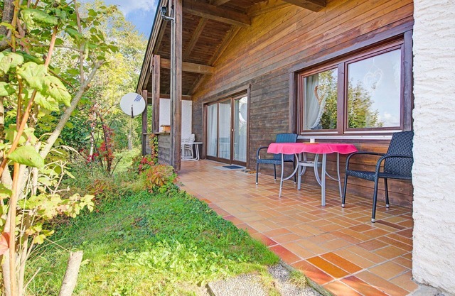 Quaint Chalet with Garden, Terrace, Fireplace,Play Equipment