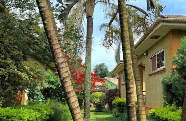 Quiet and peaceful hidden gem surrounded by lush greenery and vibrant flowers.n