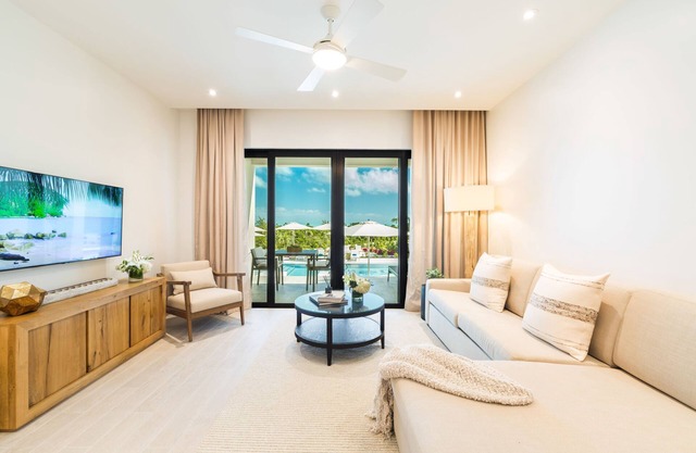 Relax on a Juliette balcony with an ocean & pool view!