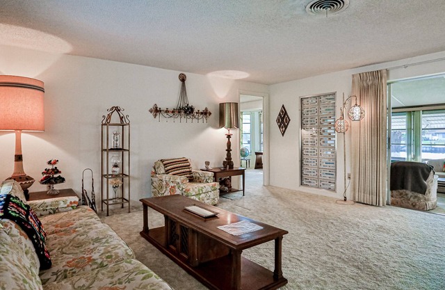 Relax, Work, or Play in this Retro Waterfront Home with Sunsets & Private Dock