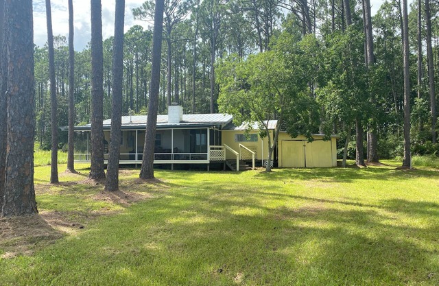 Remodeled historic cottage with a peek of the Gulf of Mexico.