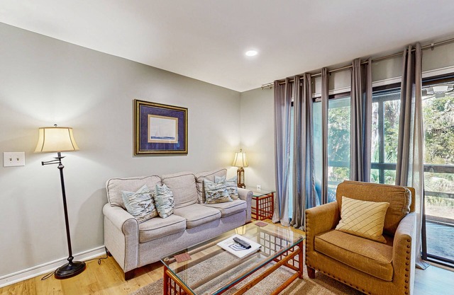 Renovated lagoon-view condo with screened porch & WiFi - steps from the beach