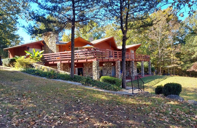 RIR: E Faye Jones style Rock floor to ceiling in 3 bathrooms open floor plan.