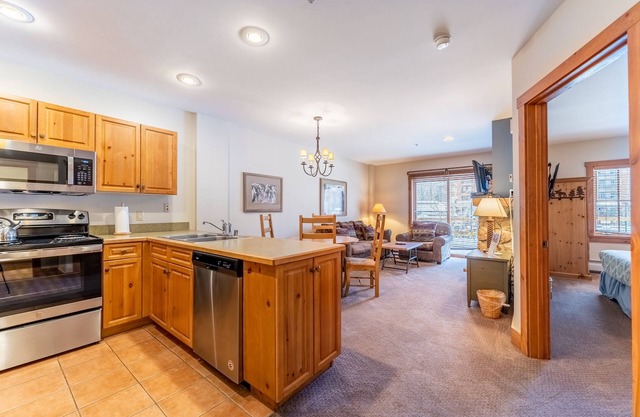 River Run Condo with Spacial Balcony overlooking Ice Rink & Mountain Views!