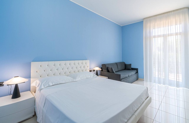 Room 'Blue Sky - Quadrupla Deluxe' with Sea View, Wi-Fi and Air Conditioning
