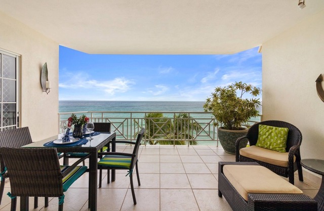 SEA SIDE LOCATION, STEPS TO A SANDY BEACH AND SWAYING PALMS!