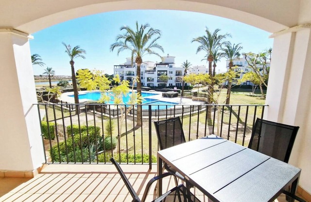 South-facing 2-bed apartment, with pool view