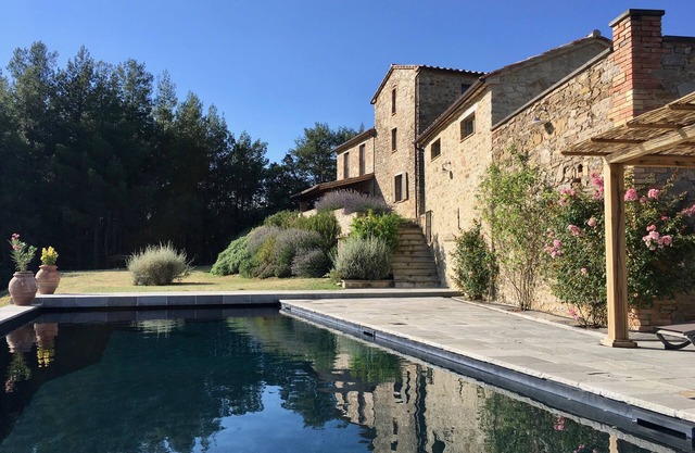Stunning hilltop villa with amazing views, pool, olive grove, vines and woods.