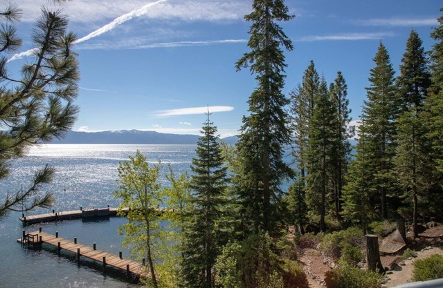 Stunning Lakefront Estate 4 acres with private pool beach piers and buoys. Incredible views!