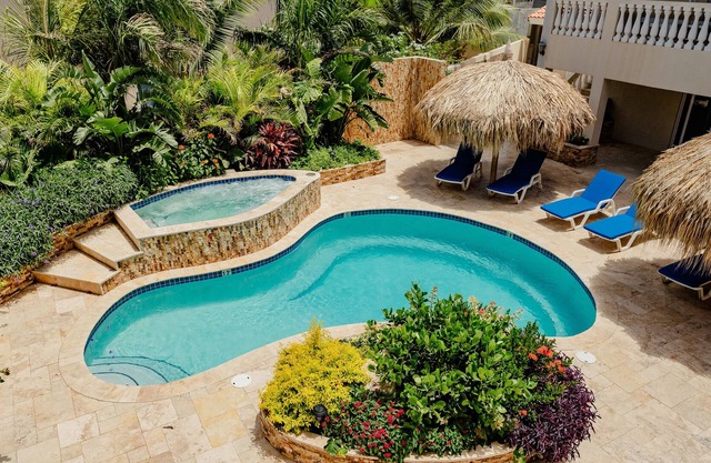 Stunning modern 2-bedroom apartment with tropical garden, pool and whirlpool