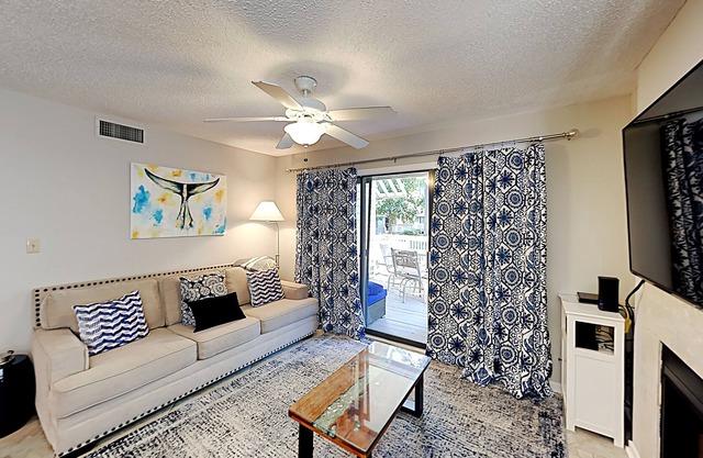 Stylish home with oversize deck & updated kitchen - walk to beach, pools, & gym