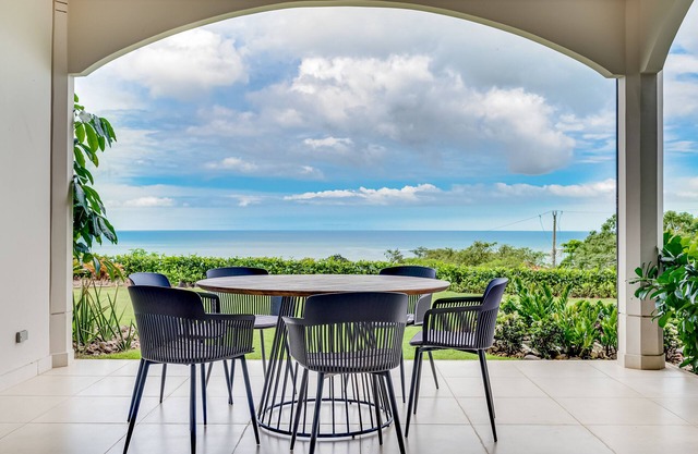 Stylish, ocean-view condo on ground floor with pool, washer/dryer, & patio