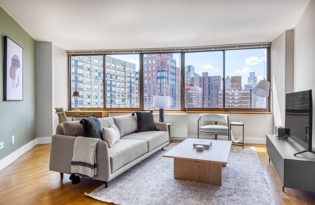 Sunlit UES 2BR w/DM, Elevator & Gym, nr Central Park, by Blueground