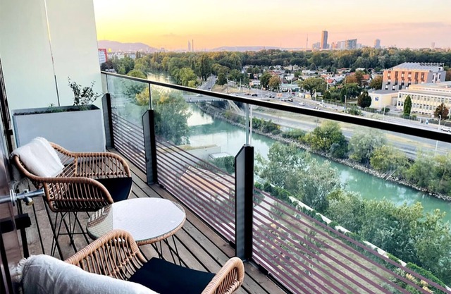 Sunrise over the park (Prater) and roof terrace pool
