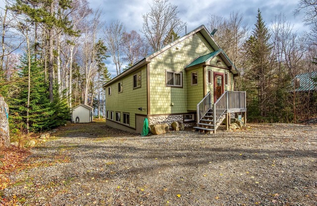 The 4 Seasons on Mooselookmeguntic Lake with dock, mooring, 4 kayaks, fire pit, and pet friendly!