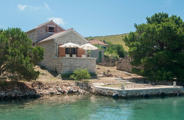 The extremely beautiful stone villa Kornati is located in central Dalmatia, south of Zadar and west