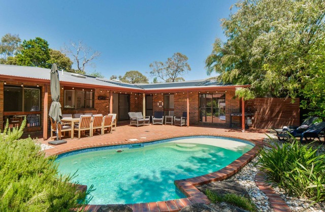 The Pool House - Pet friendly large 3 bedroom house with private solar heated pool.