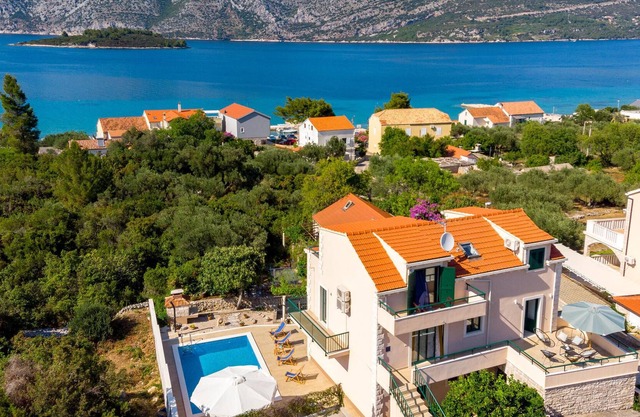 This beautiful vacation home with pool is located in a quiet location in the village of Kne.