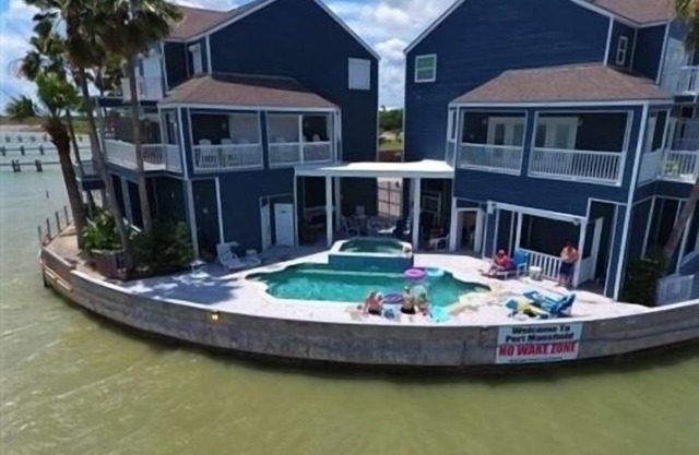 Three Bedroom, Three and a Half Bath. Private Boat Slip. Communal Pool.