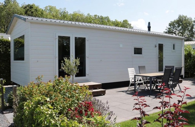 Tidy chalet with a microwave, near the Wadden Sea