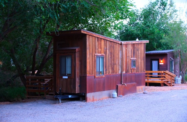 Tiny home located beside a creek.