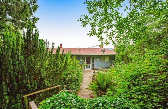 Tranquil waterfront getaway with inviting outdoor decks & beach access