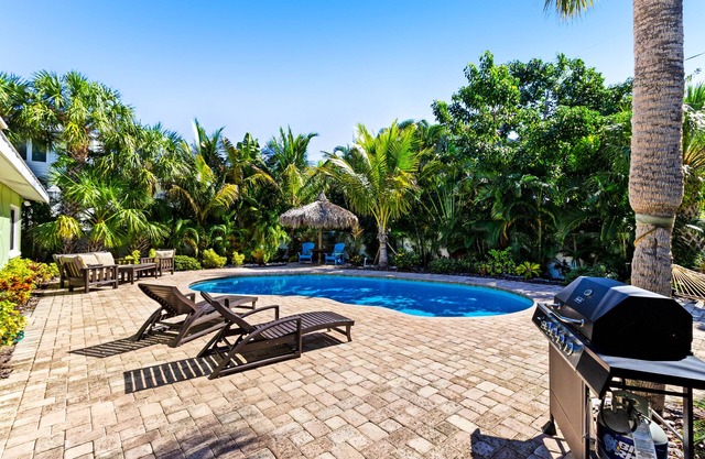Tropical-themed getaway w/ heated private pool - walk to free trolley, shopping