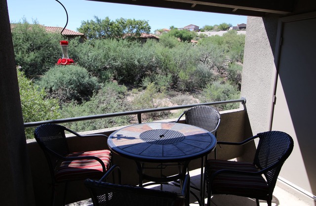 Tucson flair in this 2nd floor-serene patio -close to main pool- exercise rm