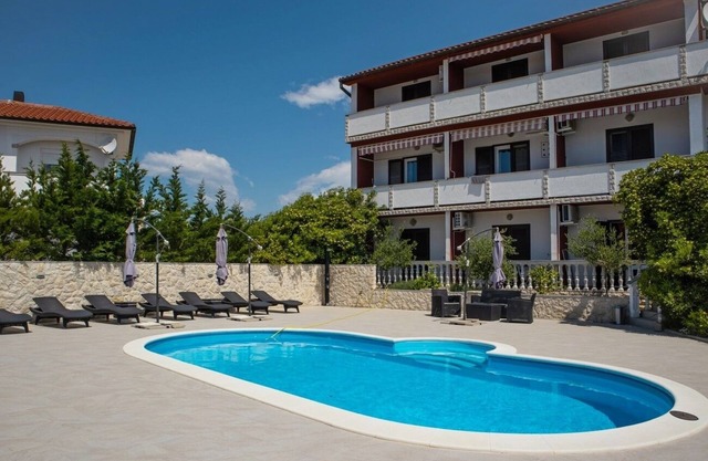 Two bedroom apartment with balcony Lopar, Rab (A-22978-b)