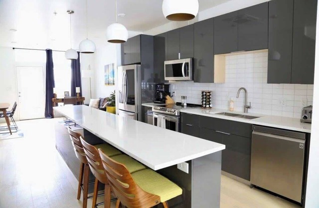 Upscale 2BR Condo w Patio, City Views, Walk to DT