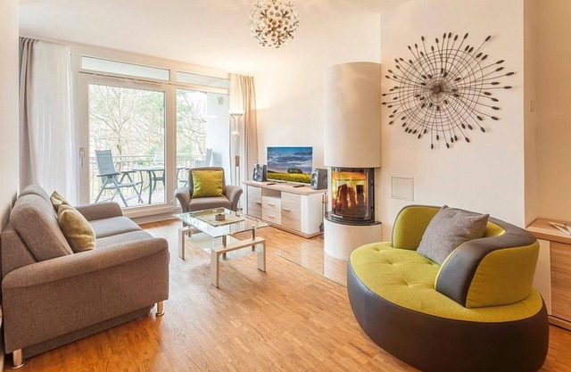 Vacation apartment with underfloor heating, wood-burning stove and balcony - only 150 m to the beach