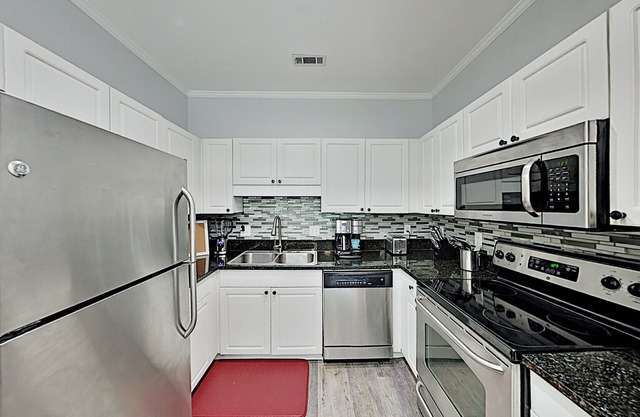 Walk to Beach & Golf! Pristine Savannah Shores Condo w/ Pool & Putting Green