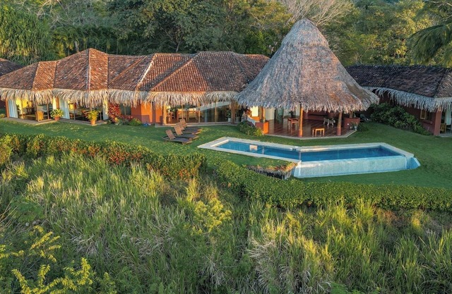 Walk to the beach from 4 bedroom house w/salt water infinity pool.